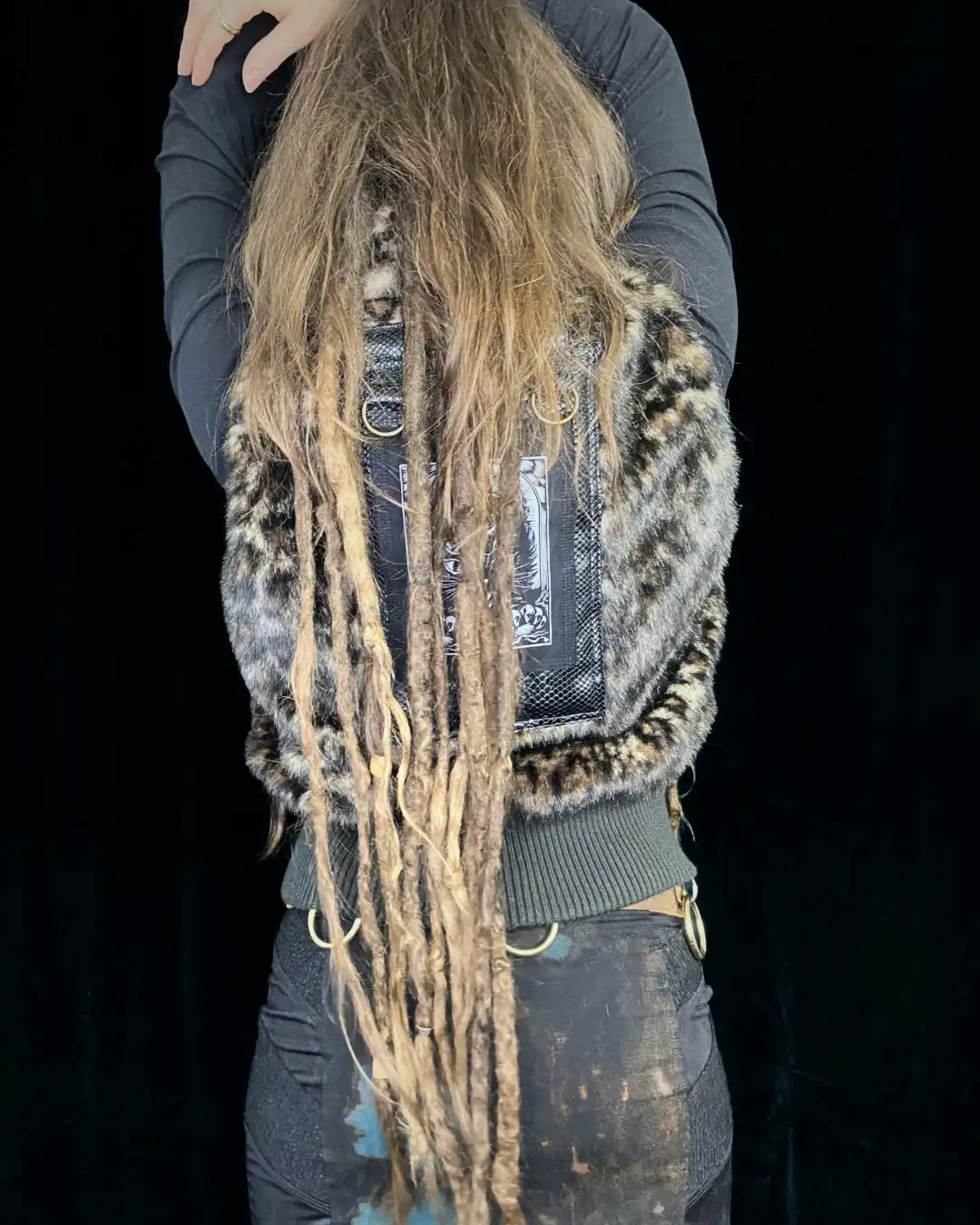 Leo fur vest with stand-up collar, metal appliqués and CAT backpatch