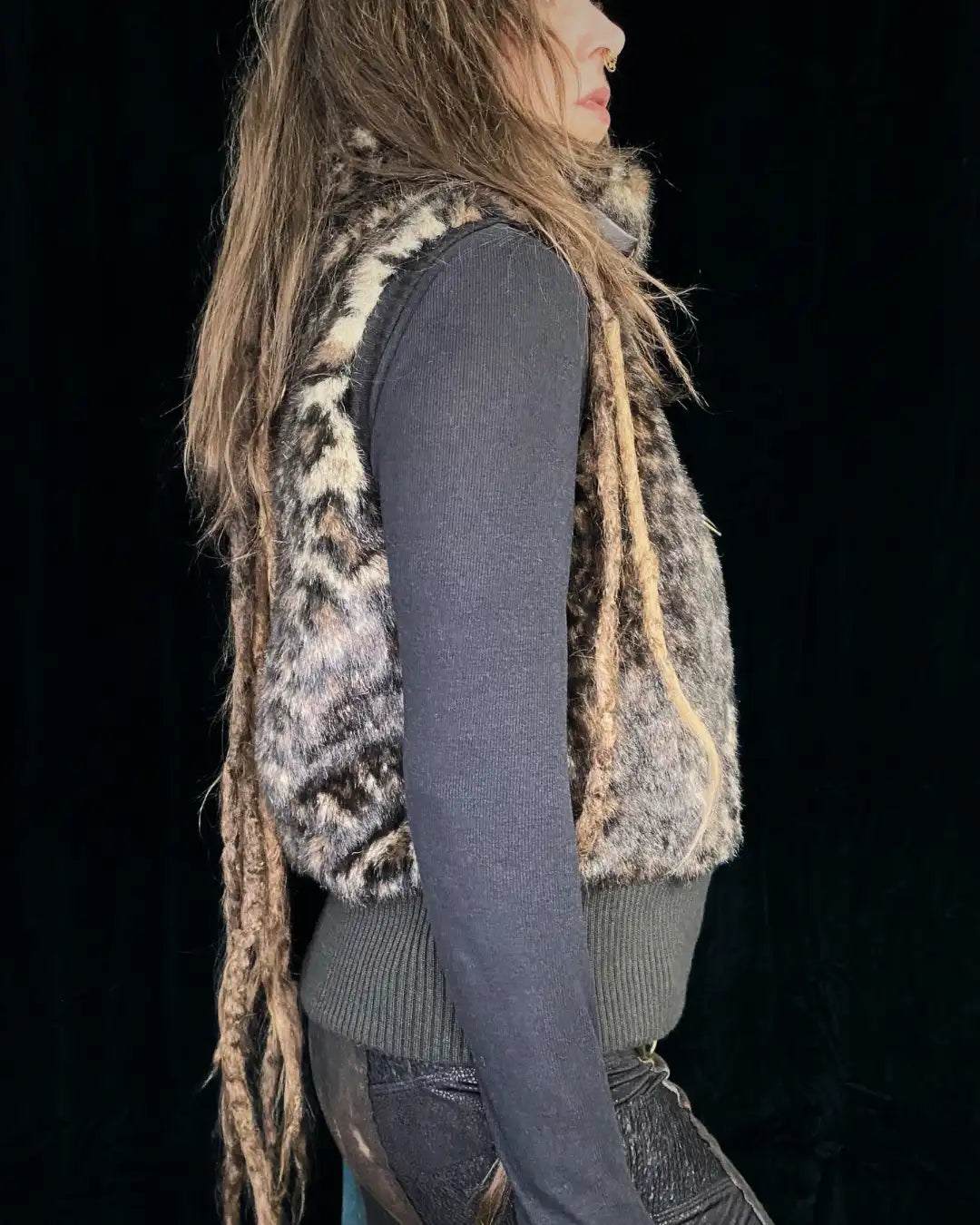 Leo fur vest with stand-up collar, metal appliqués and CAT backpatch